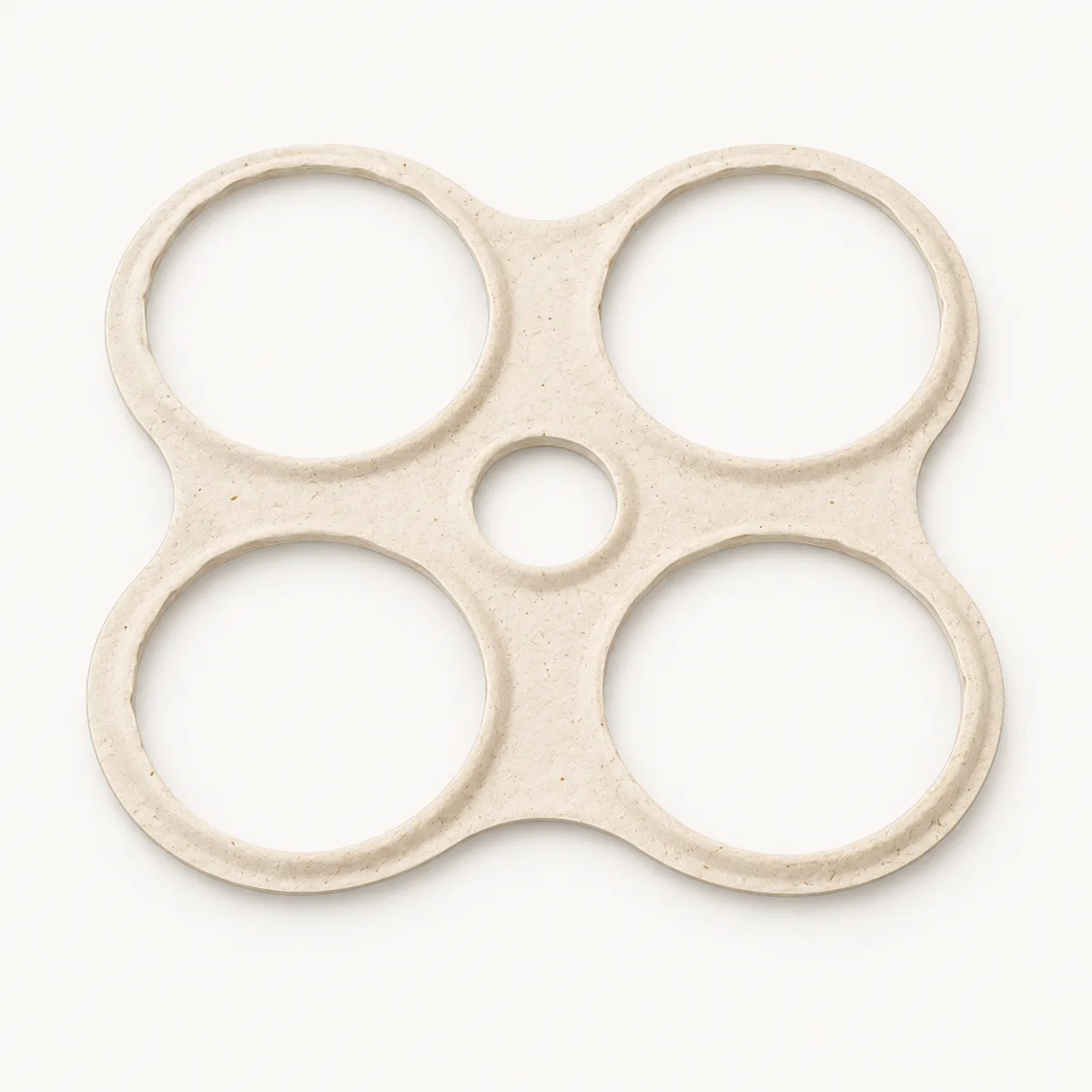 One single four-pack sugarcane fiber carrier with four can openings and one finger hole