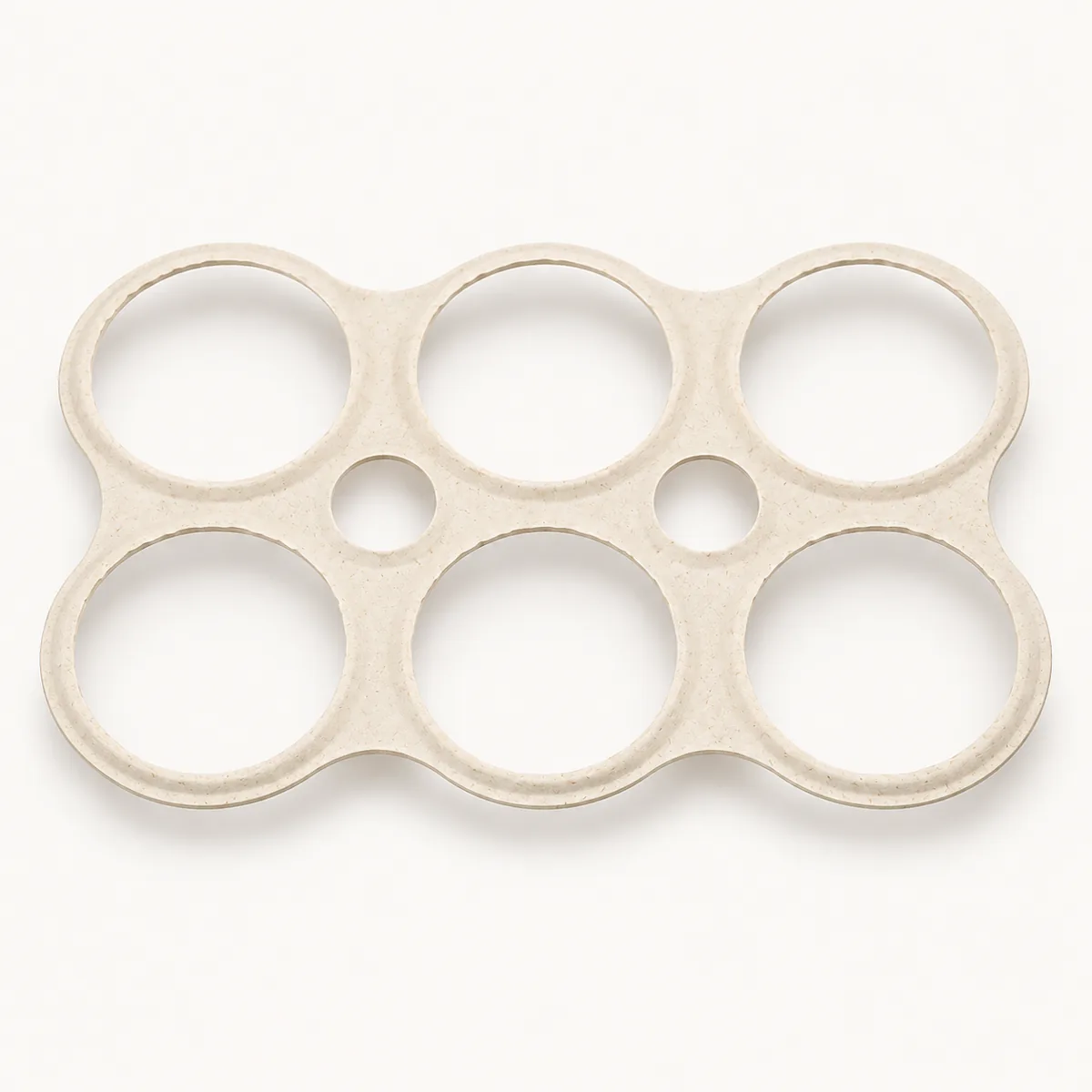 One single six-pack sugarcane fiber carrier with six can openings and two finger holes
